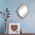 Miroir mural ovale en métal antique